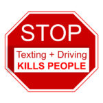 Stop sign that reads texting + driving Stop sign that reads texting + driving