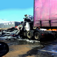 Truck trailer pickup accident with car on highway