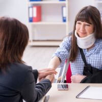 Injured employee visiting lawyer for advice on insurance Injured employee visiting lawyer for advice on insurance