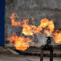 Gas pipeline leaks at the joints with the valve. Spark and Fire