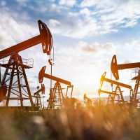 Oil pump jack work on oilfield petroleum extraction Oil pump jack work on oilfield petroleum extraction