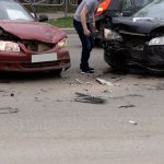 car crash accident on street, damaged automobiles after collision in city .