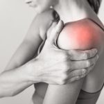 woman with pain in shoulder joint woman with pain in shoulder joint